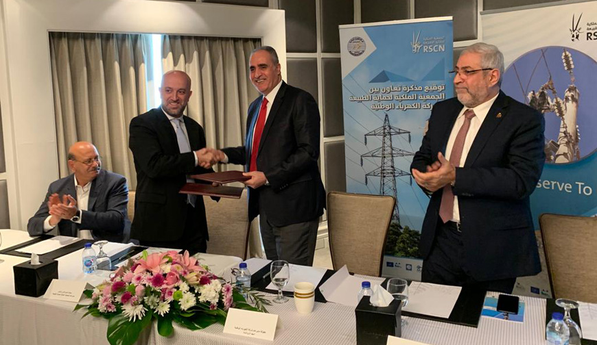 Representatives from the Royal Society for the Conservation of Nature and the National Electric Power Company signing a memorandum of understanding on Sunday (Photo courtesy of the Royal Society for the Conservation of Nature )